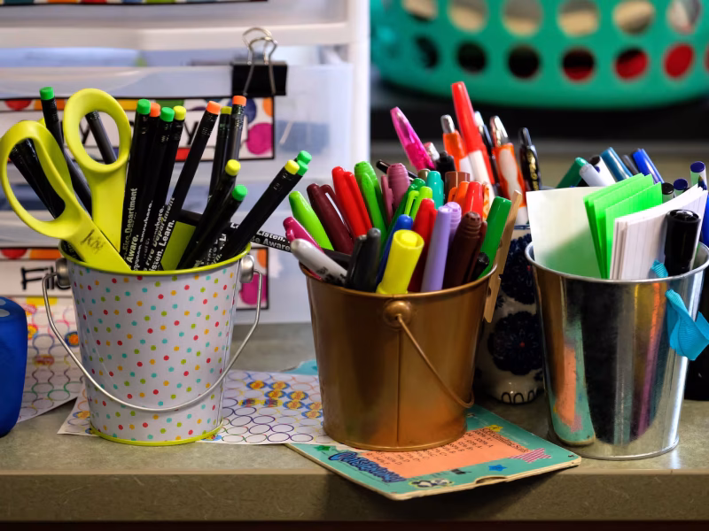 school supplies sit on a desk