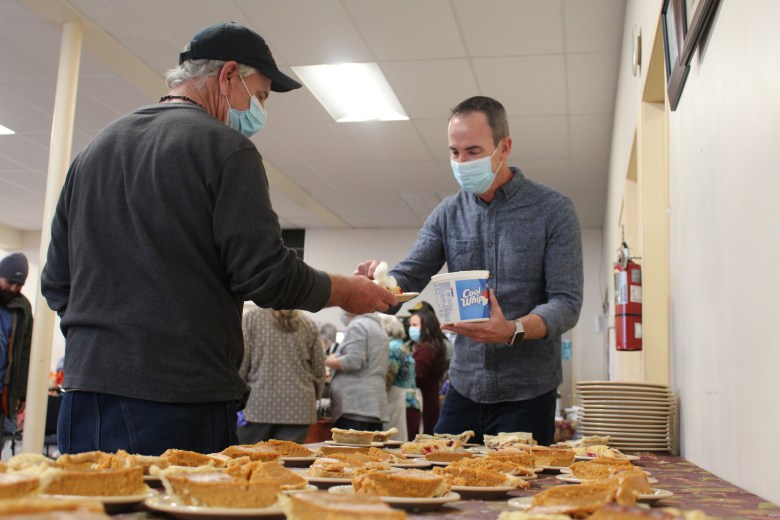 people volunteering at free meal