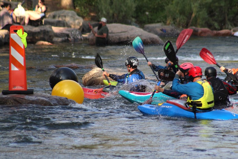 Teams Whitewater Wackos and D.A.M. Ballers compete during the July 10 downriver race at Clear Creek Whitewater Park.