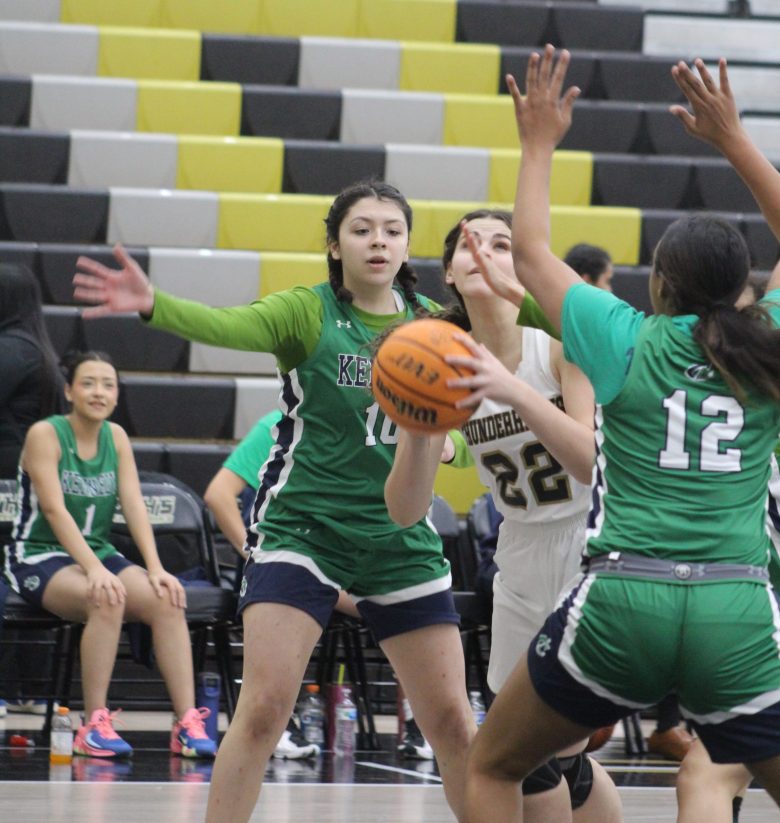 Prairie View's Lani Waterhouse lets the shot go against John F. Kennedy's Keana Venegas-Alvarez during the first round of the Nate Howard Memorial Girls Basketball Tournament at Prairie View High School on Nov. 30.